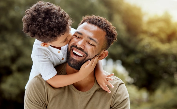 child hugging father