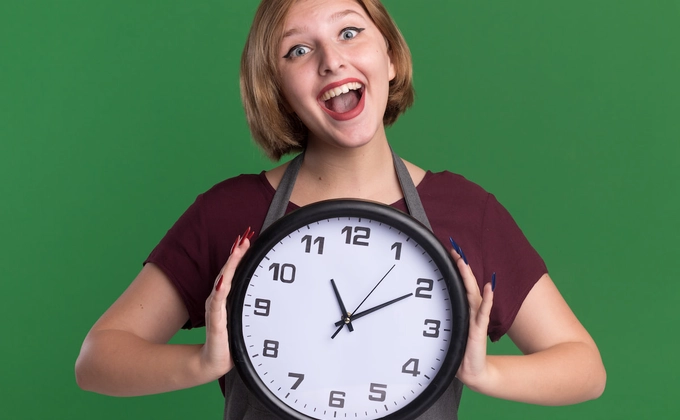happy woman holding clock