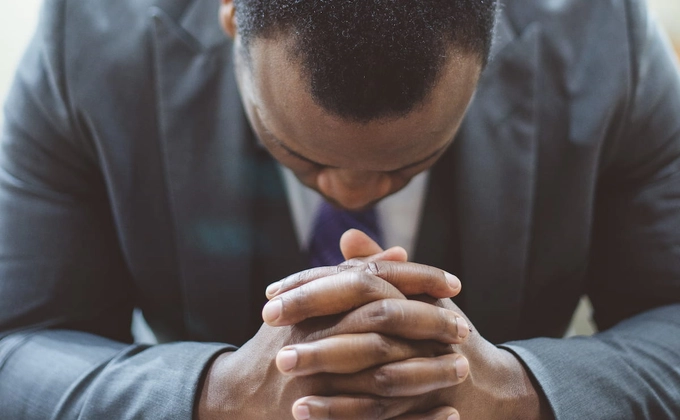 man face down praying