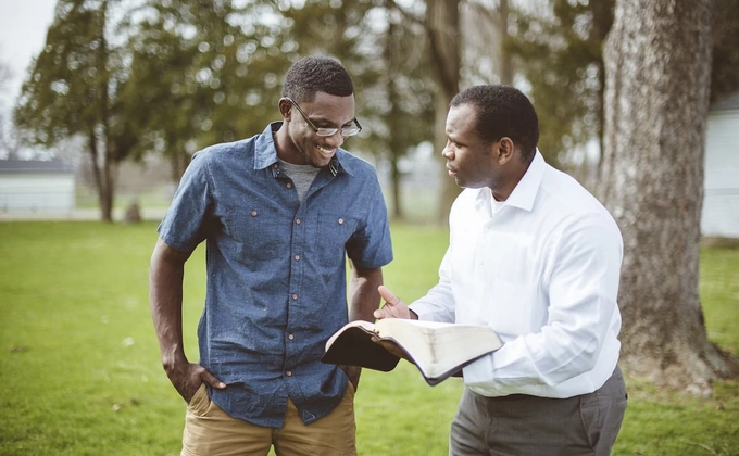 man preaching to another