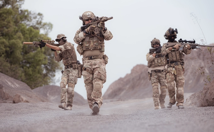 Armed soldiers advancing together, symbolizing believers enlisted in God’s army for the rescue of souls.