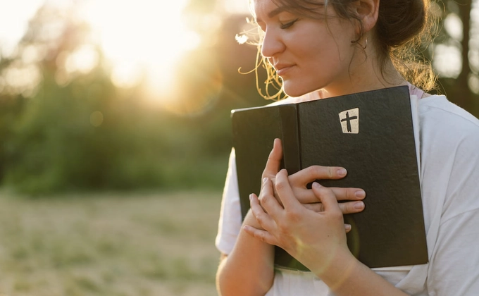 woman holding bible