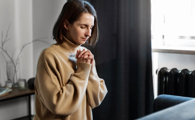 woman praying fervently