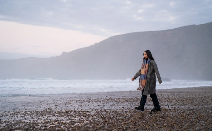 woman walking on beach