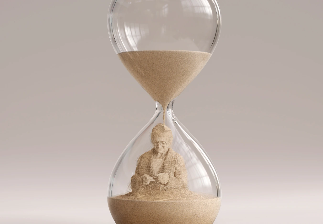 hour glass with old woman knitting