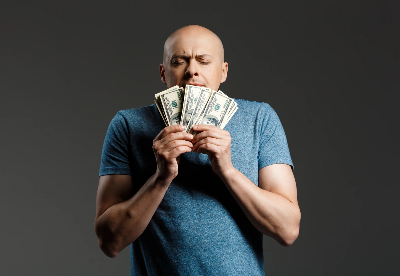 A man obsessed with money in his hands