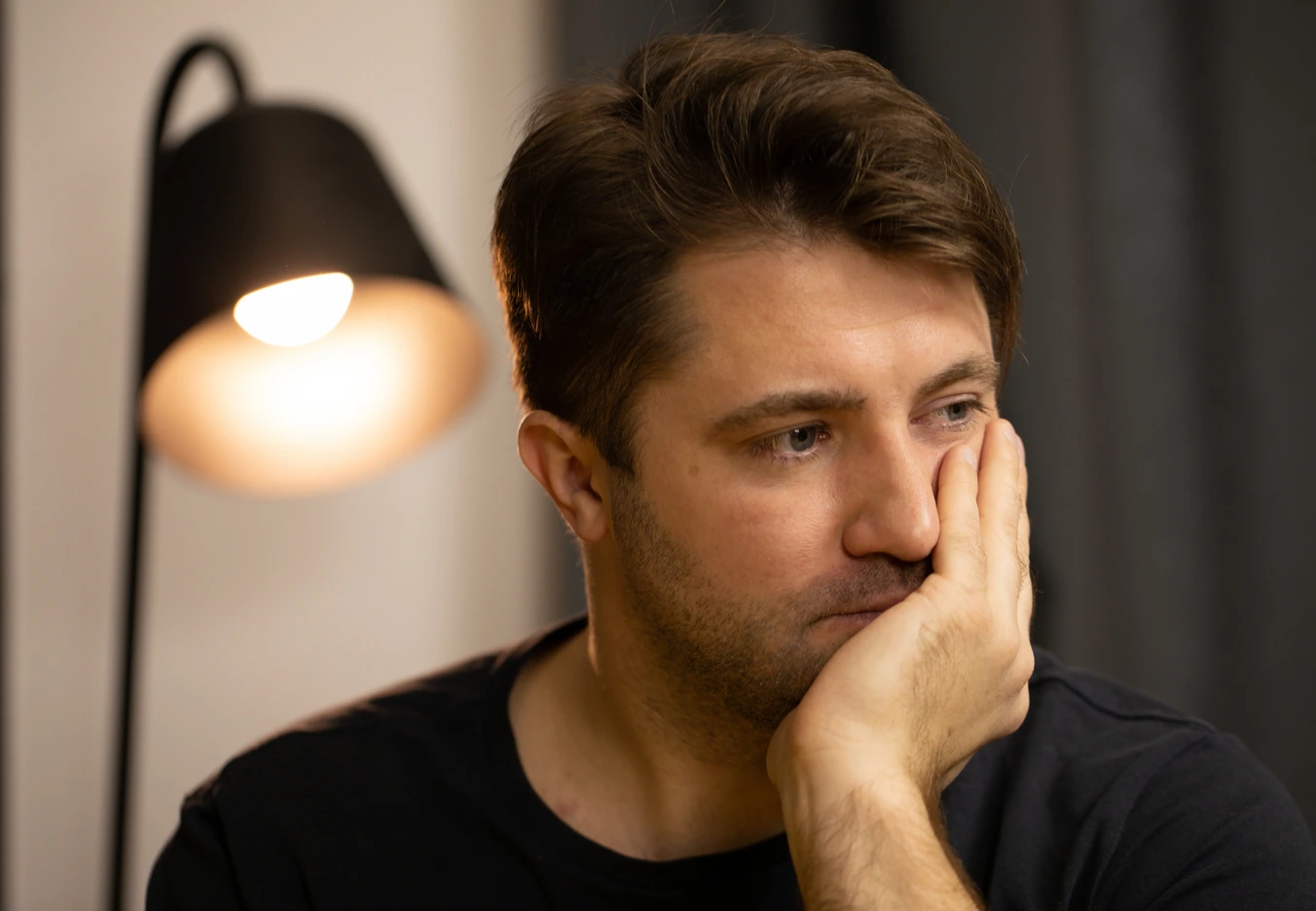 a depressed man in a state of worry