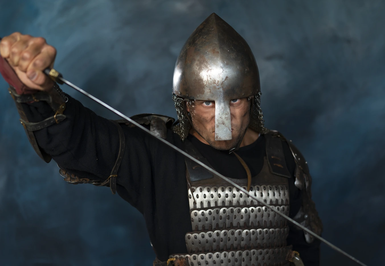 A medieval soldier posing defensively with a sword