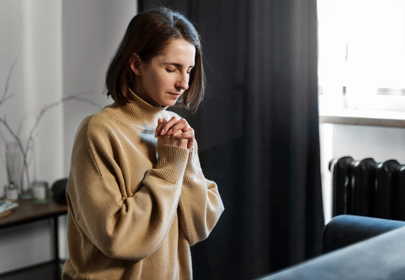 woman praying fervently