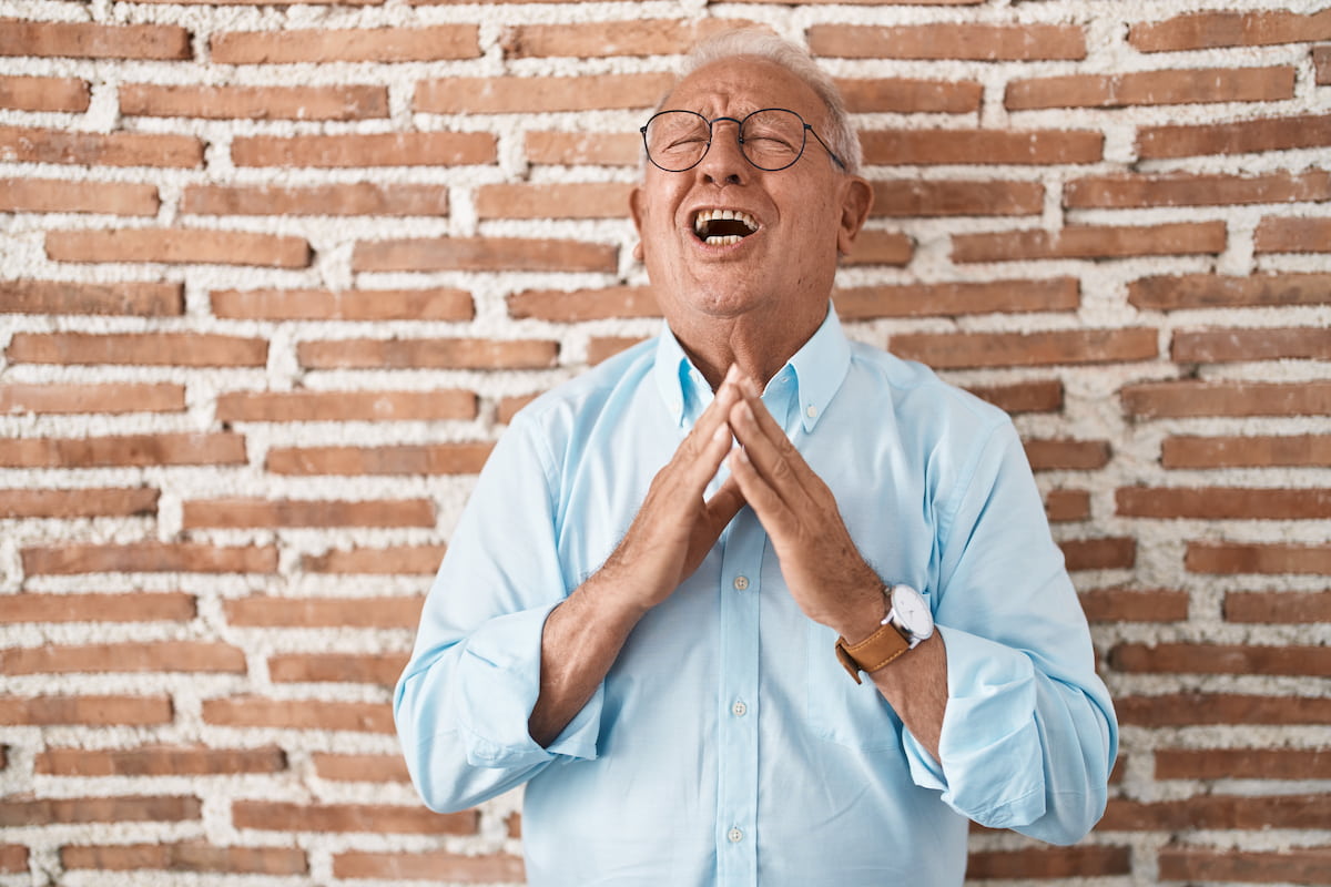 Man smiling confidently surrounded with a lovely ambience